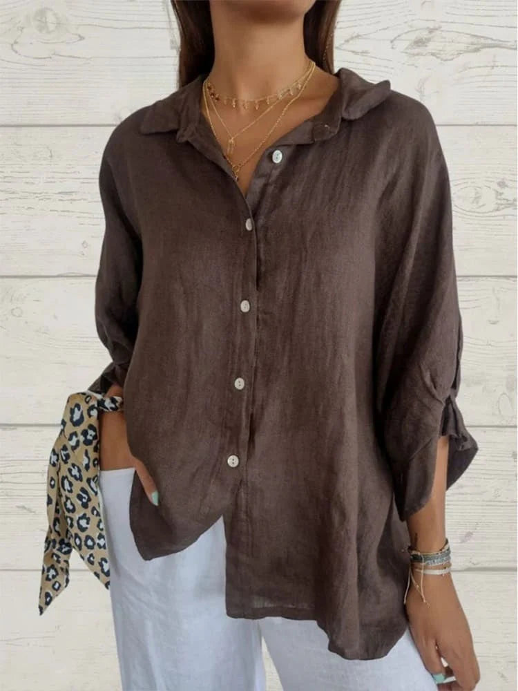 Relaxed fit linen top with V-neck and rolled sleeves for warm-weather wear