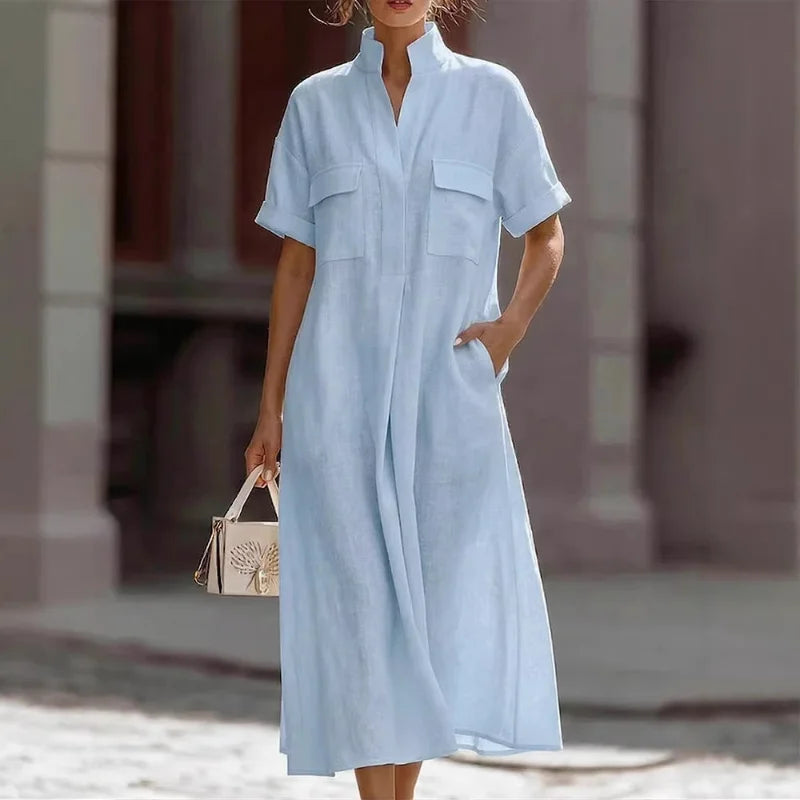Women's relaxed fit shirt dress in light blue with stand collar and chest pockets