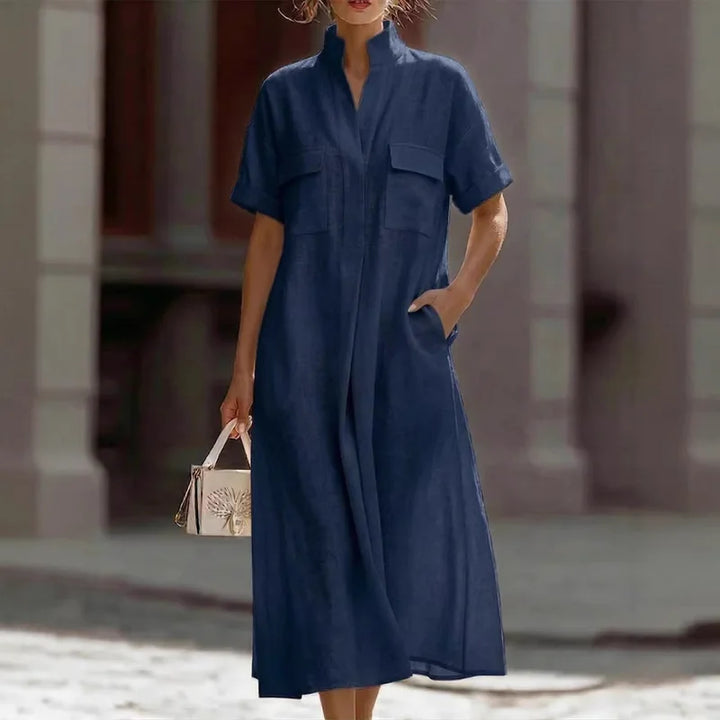 Back view of women's relaxed fit shirt dress with short sleeves and midi length